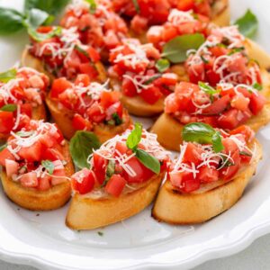 Home tomato bruschetta on platter hero